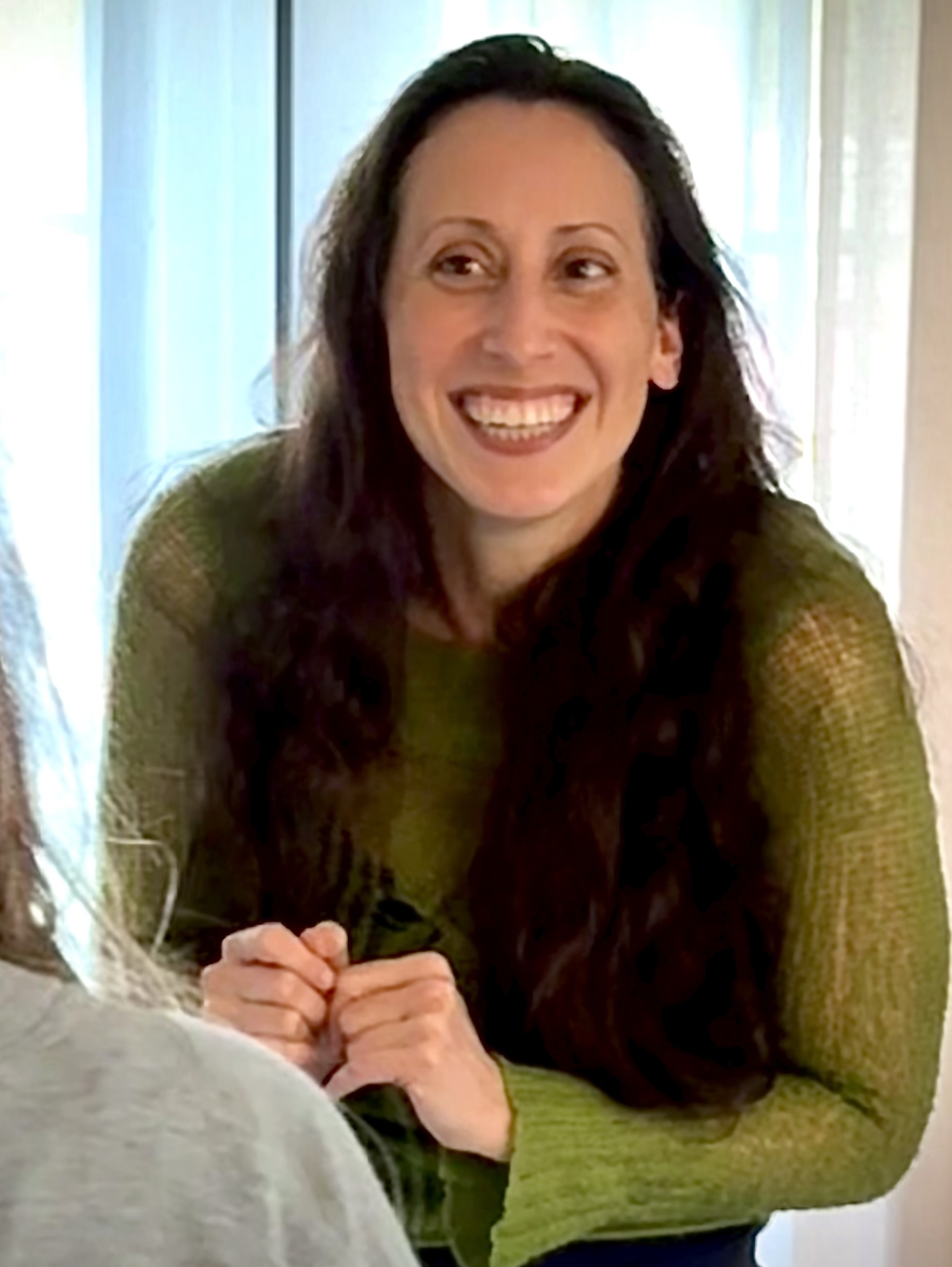 Monica Thomas, somatic therapist working with a client.