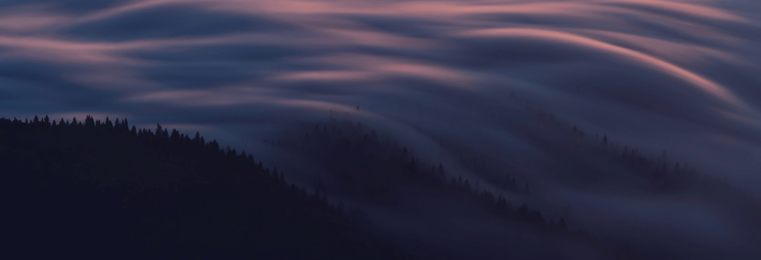 Landscape with clouds rolling over hills  representing movement.